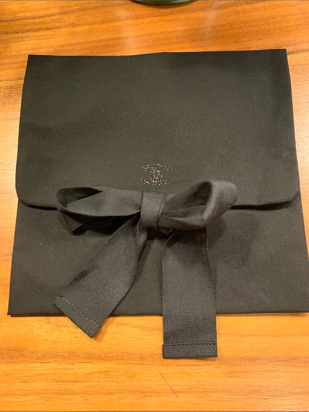 Authentic  black Chanel rare pouch with CC sparky logo with closing strops.Must!